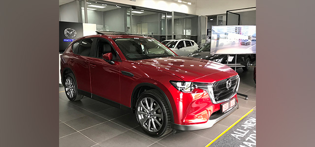 Red Mazda CX60 on the showroom floor